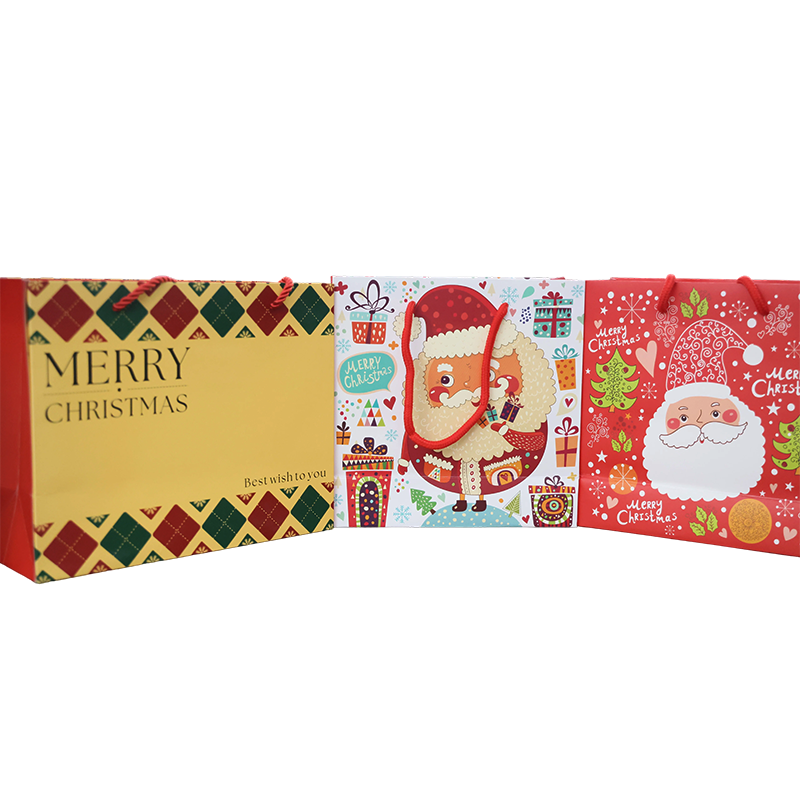Sac cadeau en carton blanc sur le thème de Noël avec poignée en corde de coton