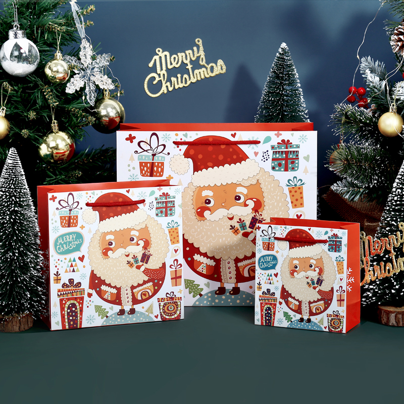 Sac cadeau en carton blanc sur le thème de Noël avec poignée en corde de coton